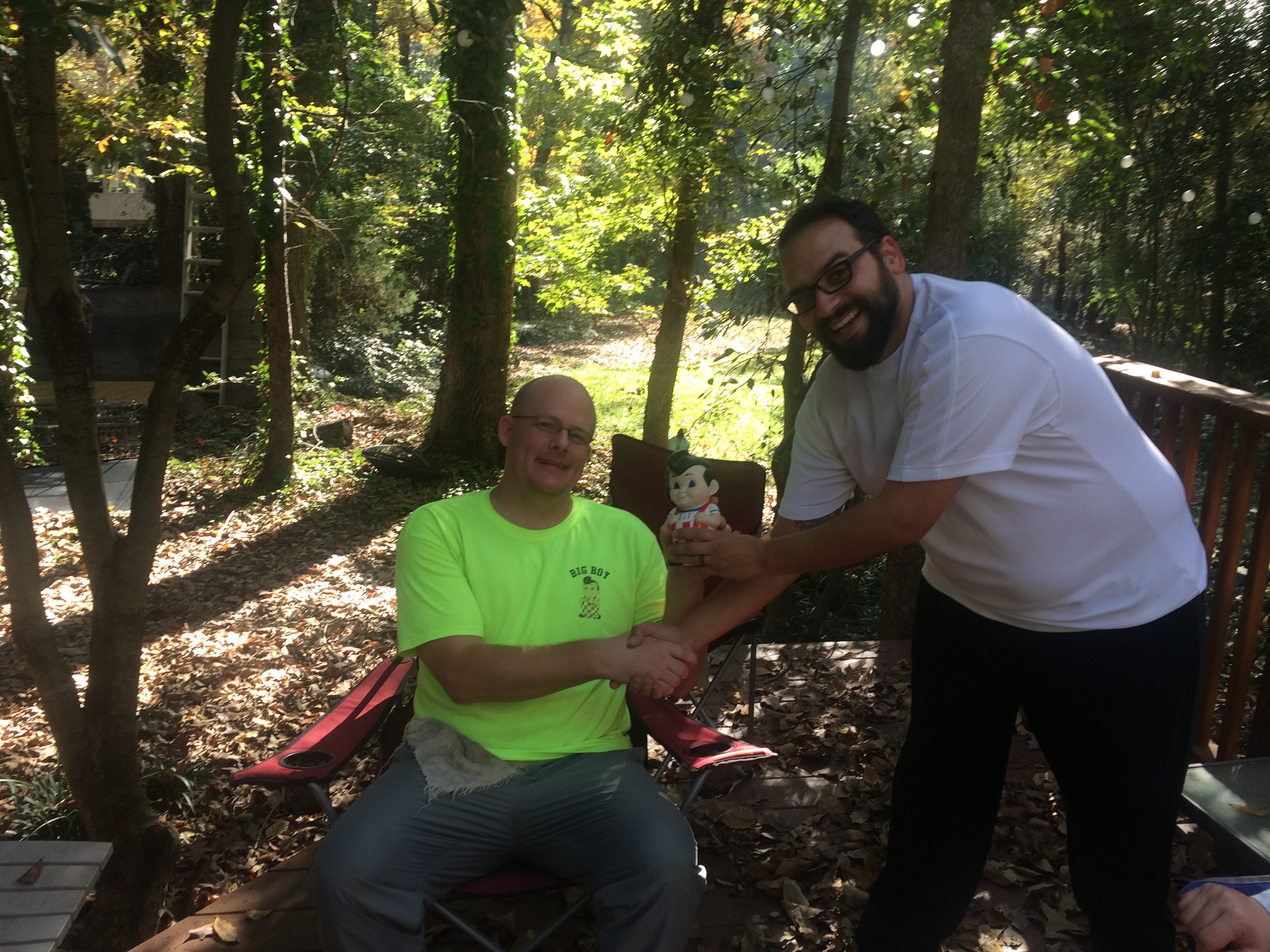 Last week's winner Paul L. presents the Big Boy to Kevin.