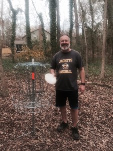 James retrieving his disc from his Hole in One on 18.